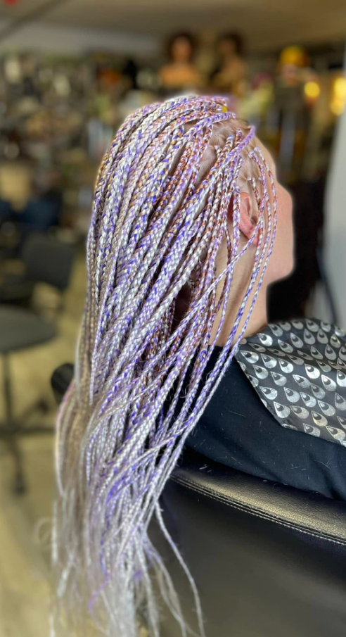 Long lilac and silver knotless braids styled at Bangu Afro Salon